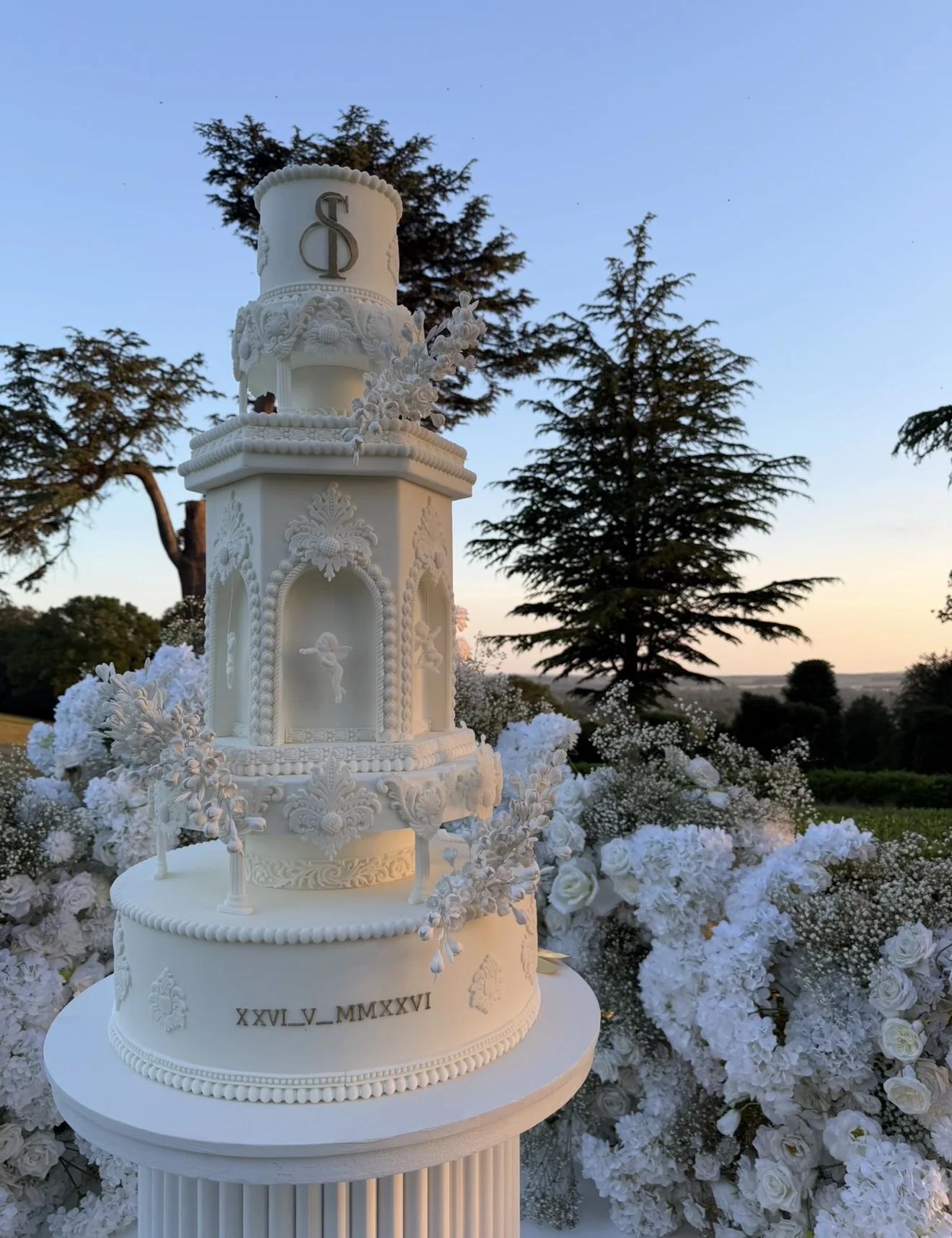 Lovestruck from The MDC Range Lovestruck ivory wedding cake with sculpted arches and floral details